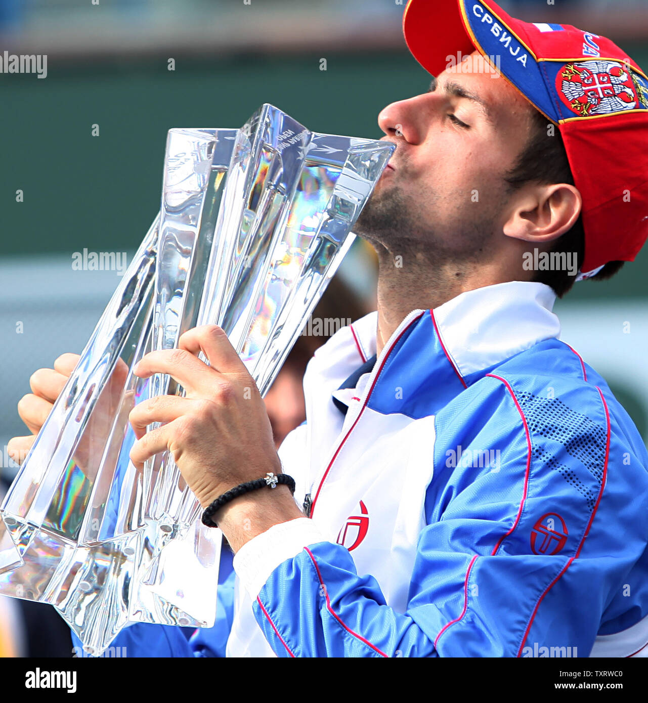 Serbian Novak Djokovic kisses the championship trophy after winning his mens final match against Spaniard Rafael Nadal at the BNP Paribas Open in Indian Wells, California on March 20, 2011.  Djokovic defeated Nadal 4-6, 6-3, 6-2 to win the tournament.   UPI/David Silpa Stock Photo