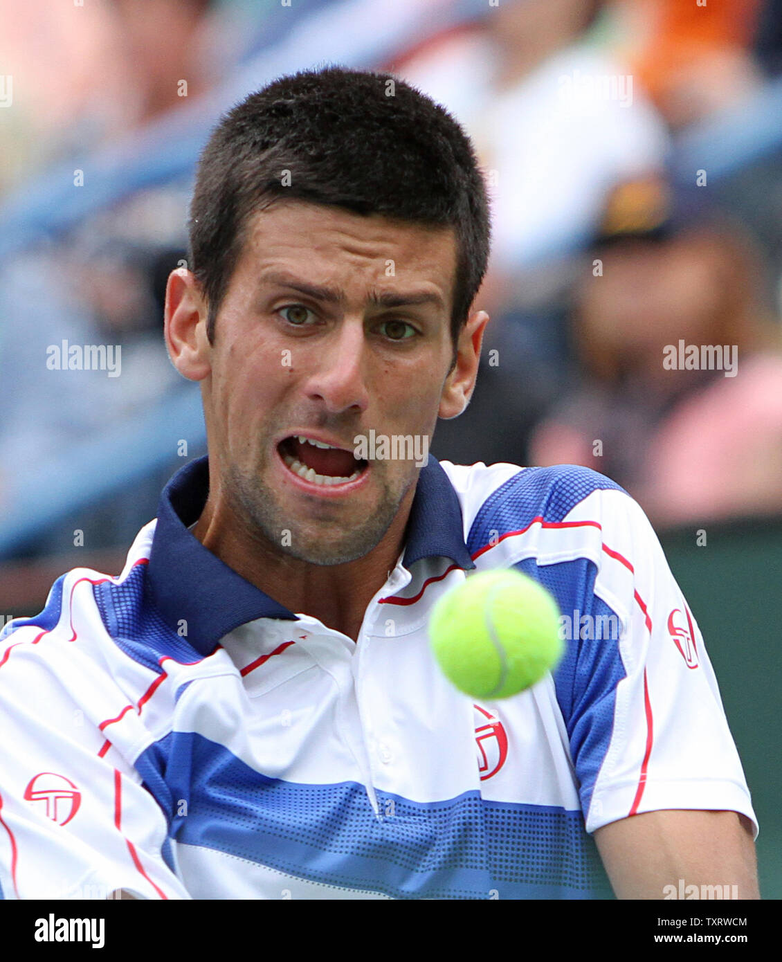 Serbian Novak Djokovic watches the ball while hitting a shot during his mens final match against Spaniard Rafael Nadal at the BNP Paribas Open in Indian Wells, California on March 20, 2011.  Djokovic defeated Nadal 4-6, 6-3, 6-2 to win the tournament.   UPI/David Silpa Stock Photo