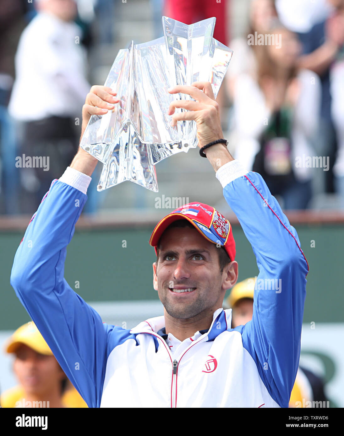 Serbian Novak Djokovic holds the championship trophy after winning his mens final match against Spaniard Rafael Nadal at the BNP Paribas Open in Indian Wells, California on March 20, 2011.  Djokovic defeated Nadal 4-6, 6-3, 6-2 to win the tournament.   UPI/David Silpa Stock Photo