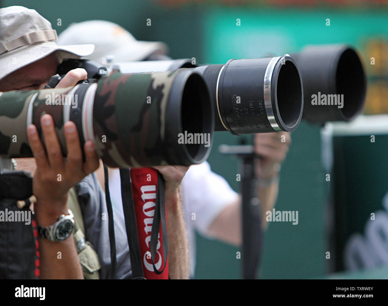 Photographers are seen shooting the mens final match between Spaniard Rafael Nadal and Serbian Novak Djokovic at the BNP Paribas Open in Indian Wells, California on March 20, 2011.  Djokovic defeated Nadal 4-6, 6-3, 6-2 to win the tournament.   UPI/David Silpa Stock Photo