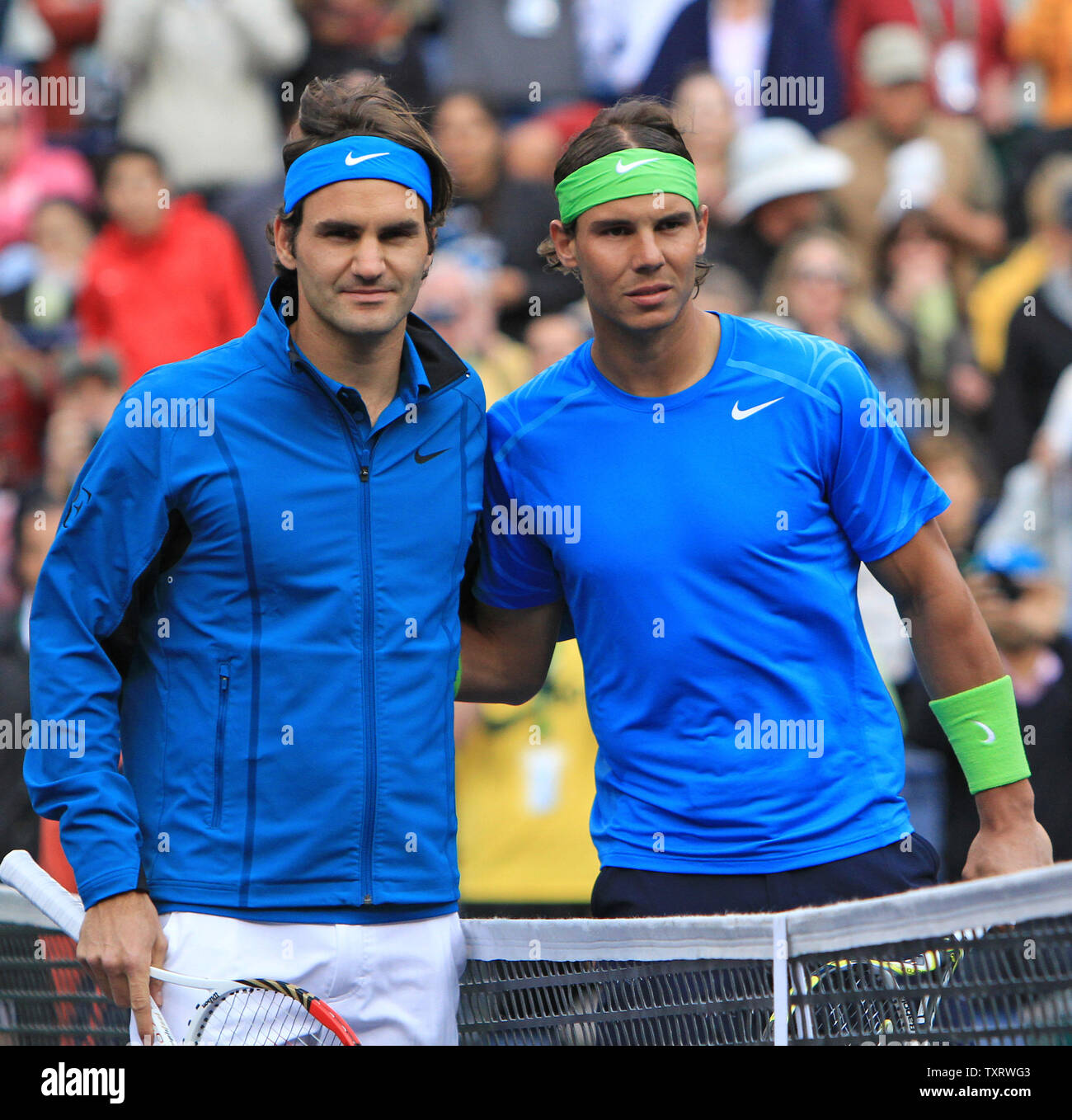 Roger Federer of Switzerland (L) and Spaniard Rafael Nadal meet at the net  before the start of their mens semifinal match at the BNP Paribas Open in  Indian Wells, California on March
