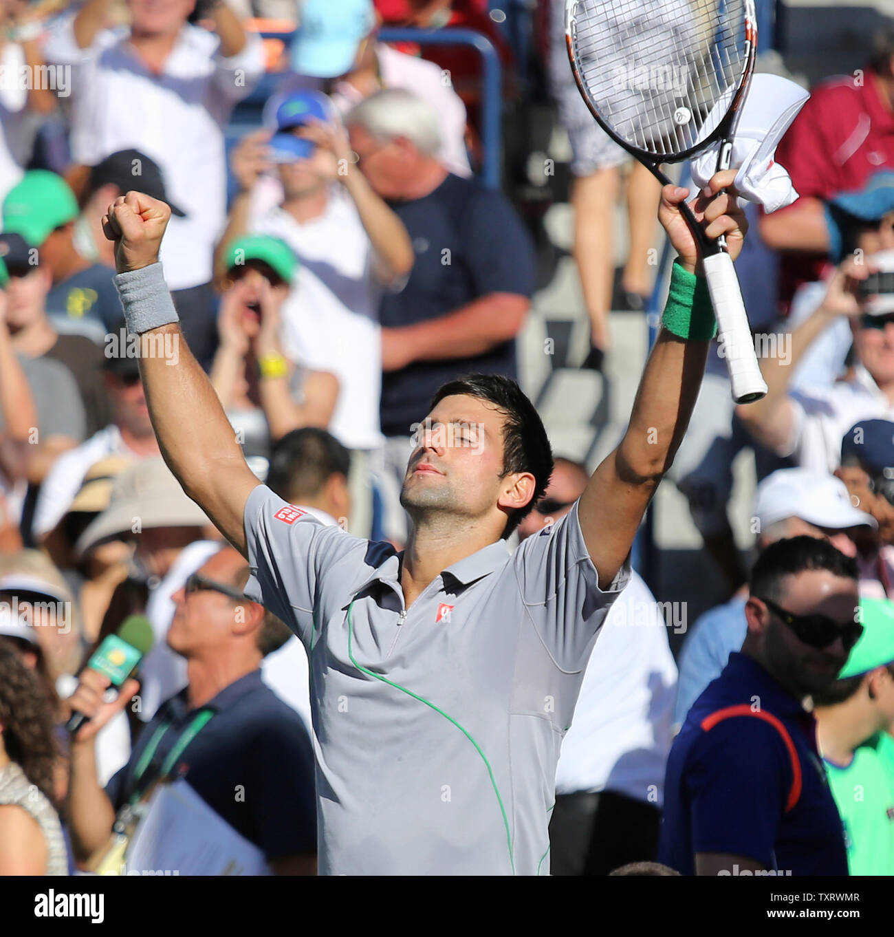 Novak Djokovic of Serbia celebrates after winning his men's final match  against Roger Federer of Switzerland at the BNP Paribas Open in Indian Wells,  California on March 16, 2014. Djokovic defeated Federer