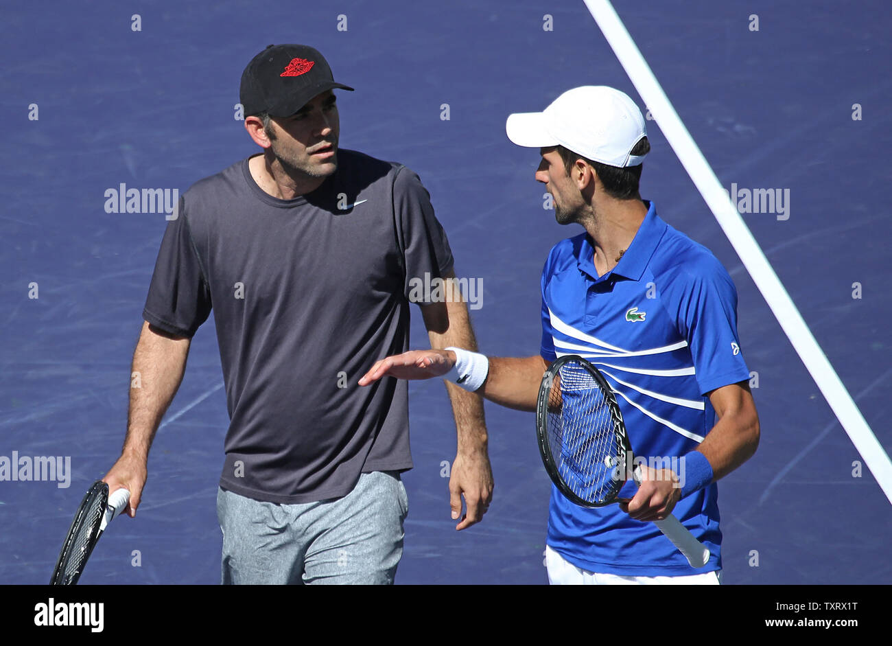american-pete-sampras-l-and-novak-djokovic-of-serbia-talk-to-each-other-after-a-point-during-an-exhibition-match-at-the-bnp-paribas-open-in-indian-wells-california-on-march-16-2019-the-exhibition-was-arranged-after-the-cancellation-of-the-semifinals-match-between-roger-federer-and-rafael-nadal-due-to-a-nadal-knee-injury-photo-by-david-silpaupi-TXRX1T.jpg