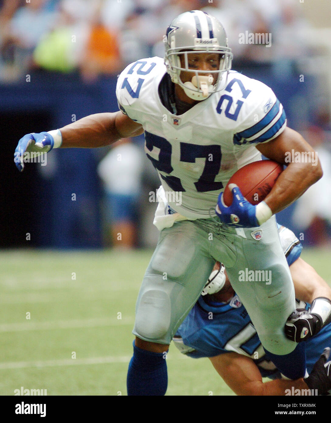 Dallas running back Eddie George escapes the grasp of a Detroit defender  during Cowboys-Lions game Oct. 31 in Irving, TX. The Cowboys defeated the  Lions 31-21. (UPI Photo/Ian Halperin Stock Photo 