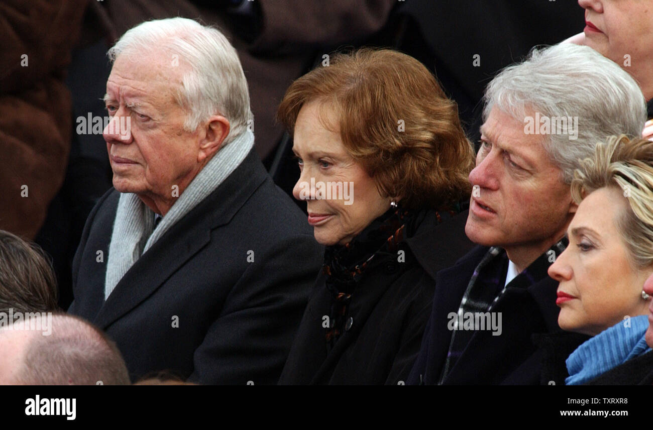 Former President Jimmy Carter, his wife Roslyn, former President Bill Clinton and his wife Sen. Hillary Rodham Clinton (l to r) attend President George W. Bush's second inauguration on Capitol Hill in Washington on Jan. 20, 2005.   (UPI Photo/Roger L. Wollenberg) Stock Photo