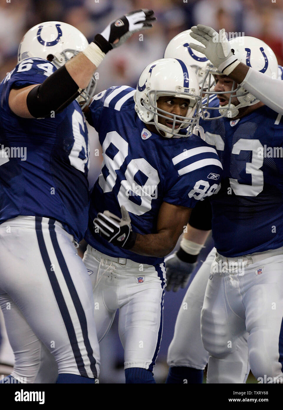Indianapolis Colts' wide receiver Marvin Harrison (88) is congratulated by teammates after scoring as the Indianapolis Colts defeated the Baltimore Ravens 20-10 at the RCA Dome in Indianapolis, IN on December 19, 2004. (UPI Photo/Mark Cowan) Stock Photo