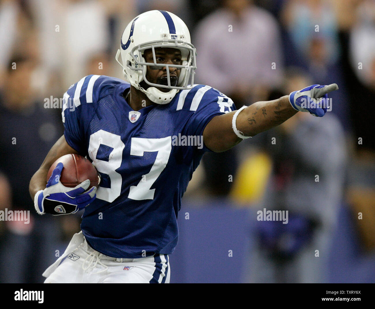 Indianapolis WR Reggie Wayne celebrates one of his two touchdowns in the AFC wild card playoff at the RCA Dome in Indianapolis, IN on January 9, 2005. The Indianapolis Colts defeated the Denver Broncos 49-24 . (UPI Photo/Mark Cowan) Stock Photo