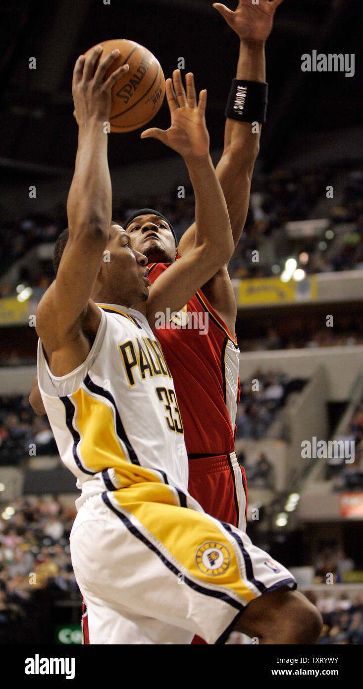 Indiana Pacers Danny Granger, bottom, gets landed on by Boston