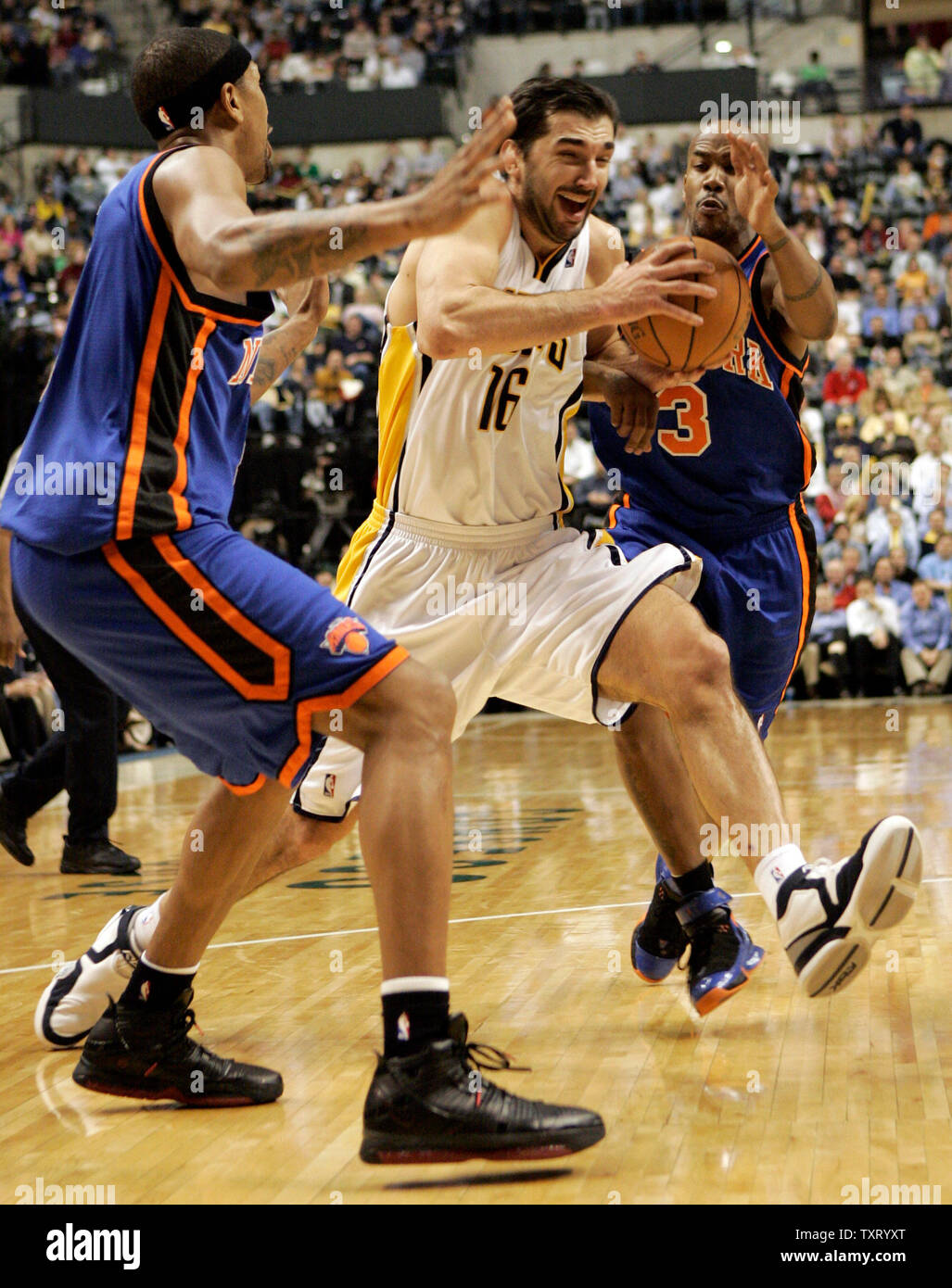 New York Knicks Jalen Rose 5 lays up a shot over Indiana Pacers Scot Pollard during the first half of an NBA basketball game in Indianapolis Tuesday March 7 2006. AP Photo Tom