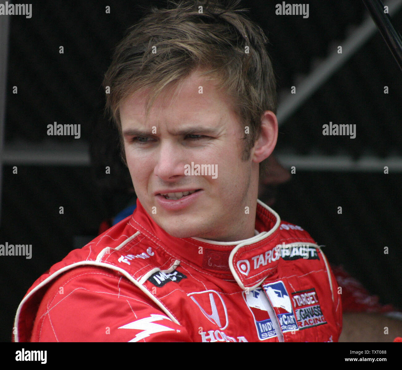 2005 Indy 500 winner Dan Weldon confers with his crew after runing laps