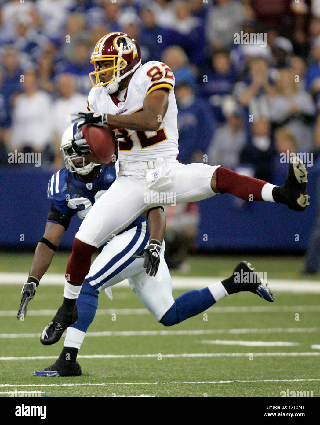 Washington Redskins wide receiver Antwaan Randle El (82) grabs a pass in front of Indianapolis Colts defensive back Mike Doss (20) at the RCA Dome in Indianapolis on October 22, 2006. (UPI Photo/Mark Cowan) Stock Photo