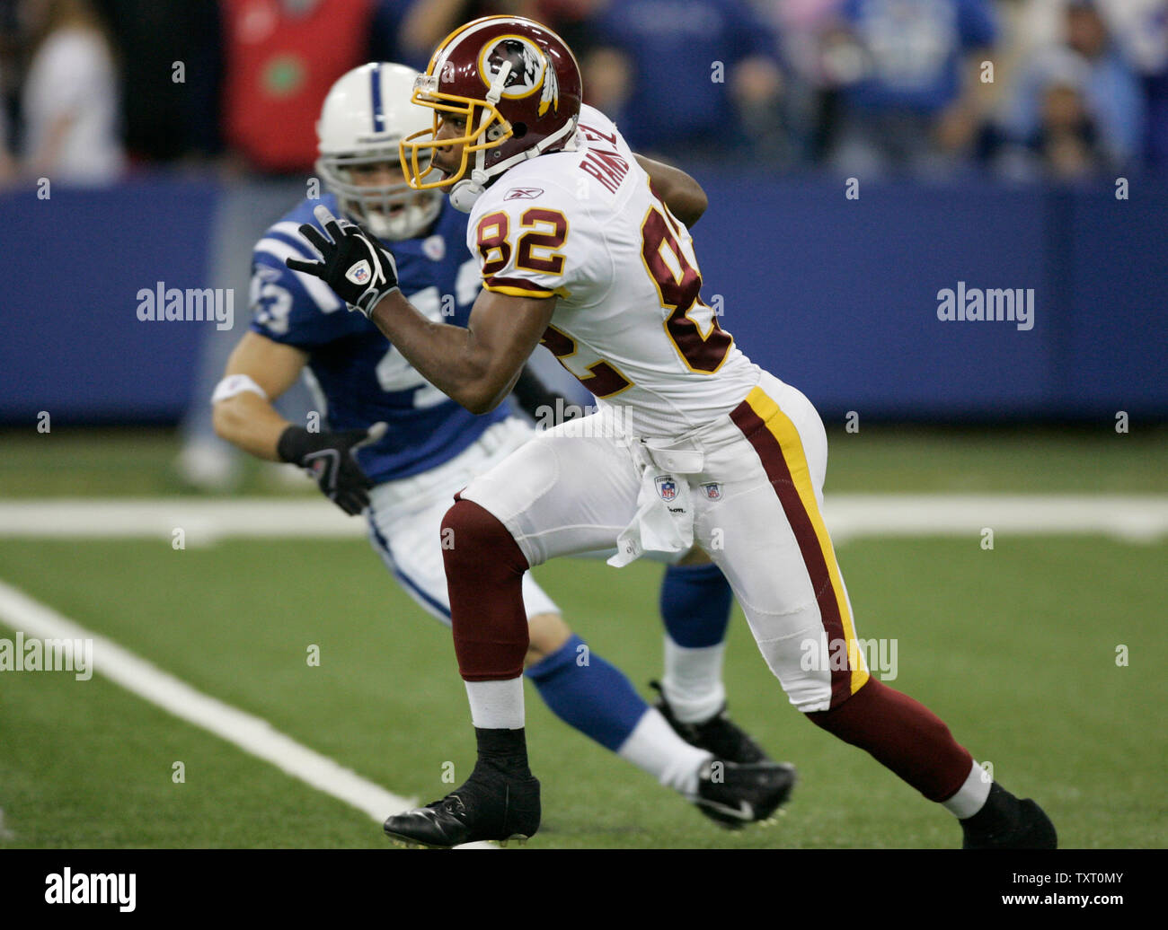 Washington Redskins punt returner Antwaan Randle El (82) breaks past Indianapolis Colts defensive back Matt Giordano (43) for a touchdown at the RCA Dome in Indianapolis on October 22, 2006. (UPI Photo/Mark Cowan) Stock Photo