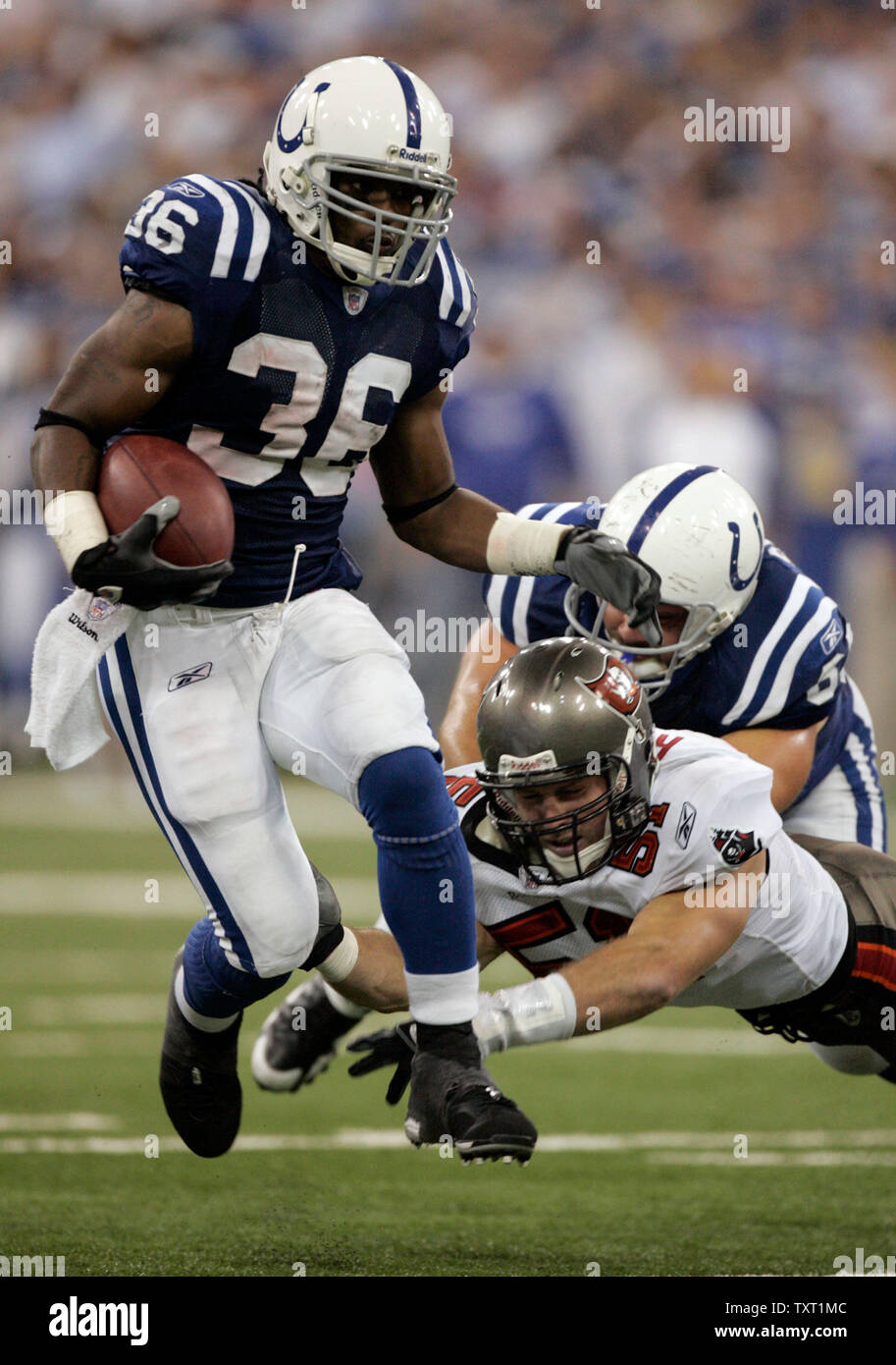 Indianapolis Colts running back Kenton Keith (36) leaps past Tampa Bay Buccaneers linebacker Barrett Rudd (51) as he is blocked by Colts center Jeff Saturday (63) in the fourth quarter at the RCA Dome in Indianapolis on October 7, 2007. The Colts defeated the Buccaneers 33-14 to remain undefeated on the season. (UPI Photo/Mark Cowan) Stock Photo