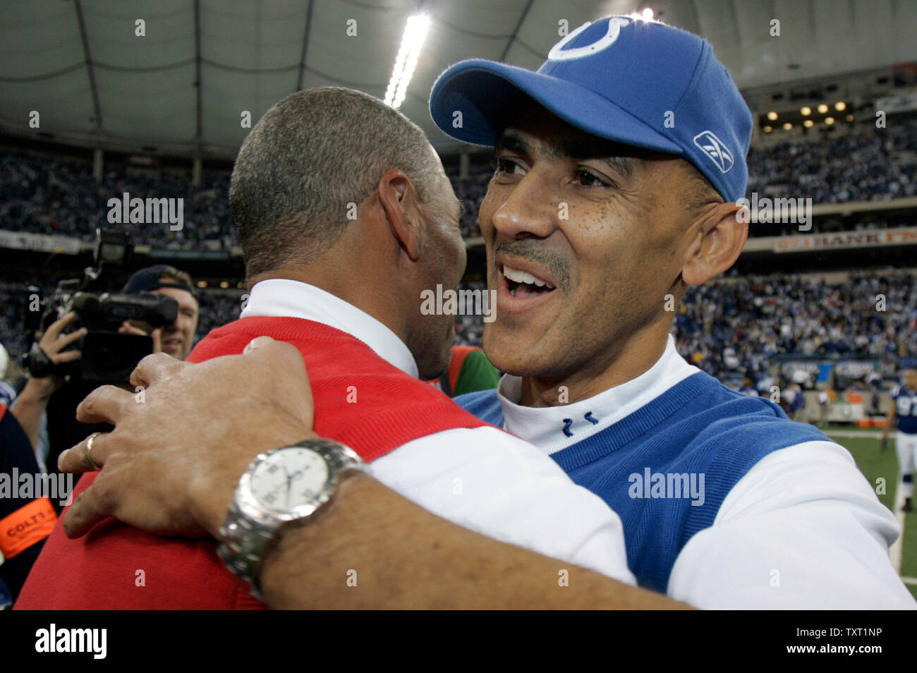 Indianapolis Colts head coach Tony Dungy, right, hugs Kansas City Chiefs head coach Herm Edwards after the Colts defeated the Chiefs 13-10 at the RCA Dome in Indianapolis on November 18, 2007. (UPI Photo/Mark Cowan) Stock Photo