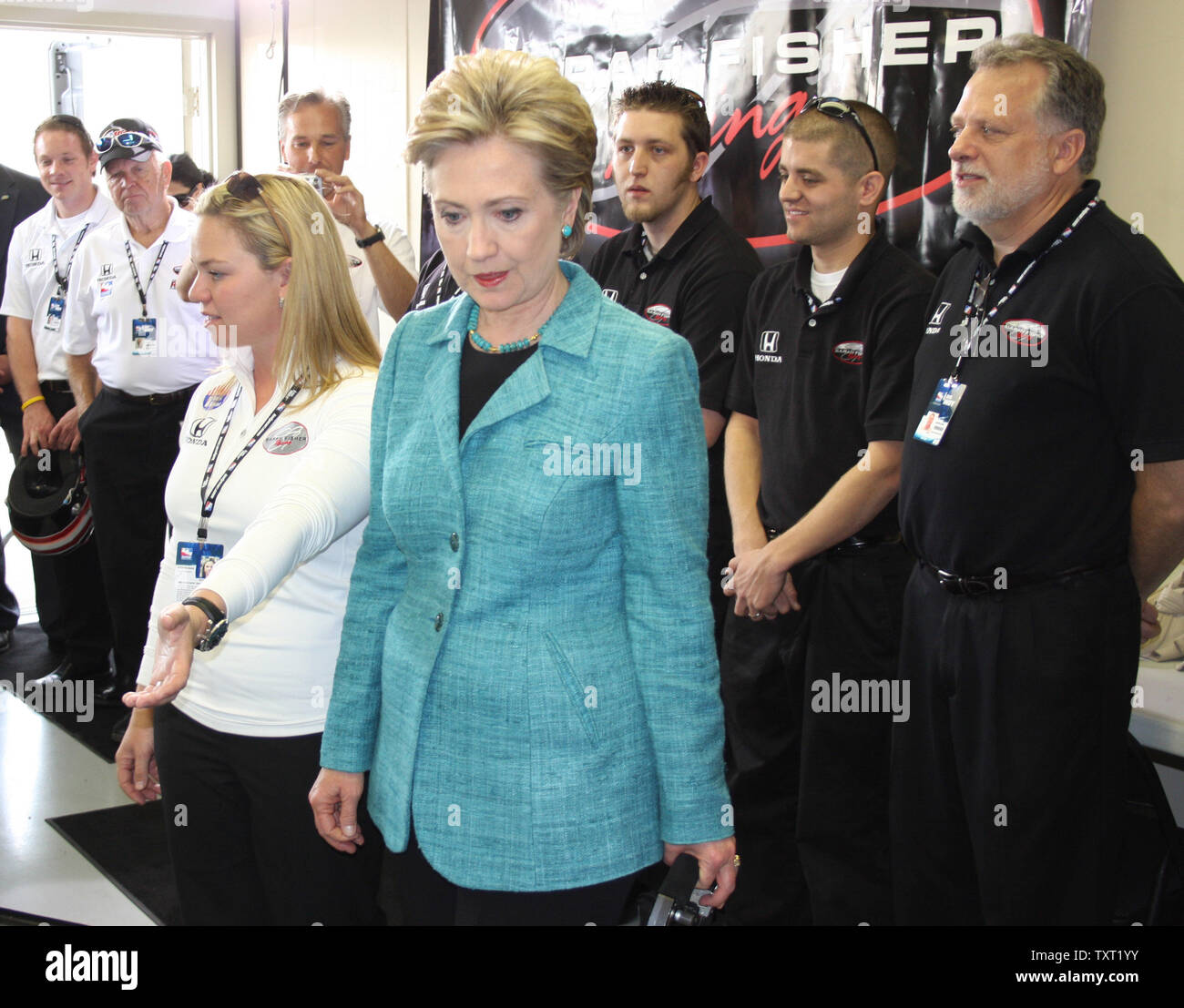 Indy 500 driver Sarah Fisher describes her car to Hillary Clinton on May 6, 2008 at the Indianapolis Motor Speedway in Indianapolis, Indiana. (UPI Photo/ Bill Coons) Stock Photo