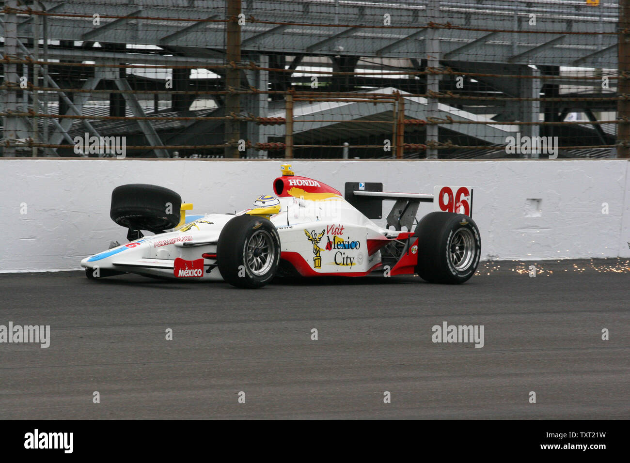 Rookie Mario Dominguez slides into the first turn wall knocking his right front wheel and suspension off on May 17, 2008 at the Indianapolis Motor Speedway in Indianapolis, Indiana. (UPI Photo/ Bill Coons) Stock Photo