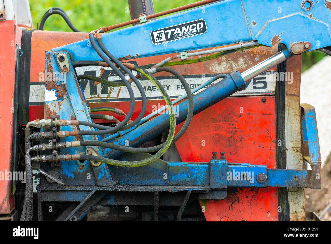 Close up of hydraulics of an old blue and red Massey Ferguson tractor Stock Photo