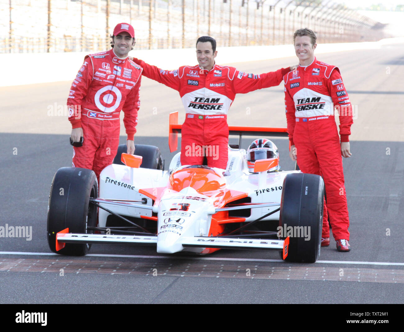 Penske team mate Ryan Briscoe and Target Team driver Dario Franchitti stand next to pole sitter Helio Castroneves during the traditional front row photo session on May 10, 2009 at the Indianapolis Motor Speedway in Indianapolis, Indiana. (UPI Photo/Ed Locke) Stock Photo