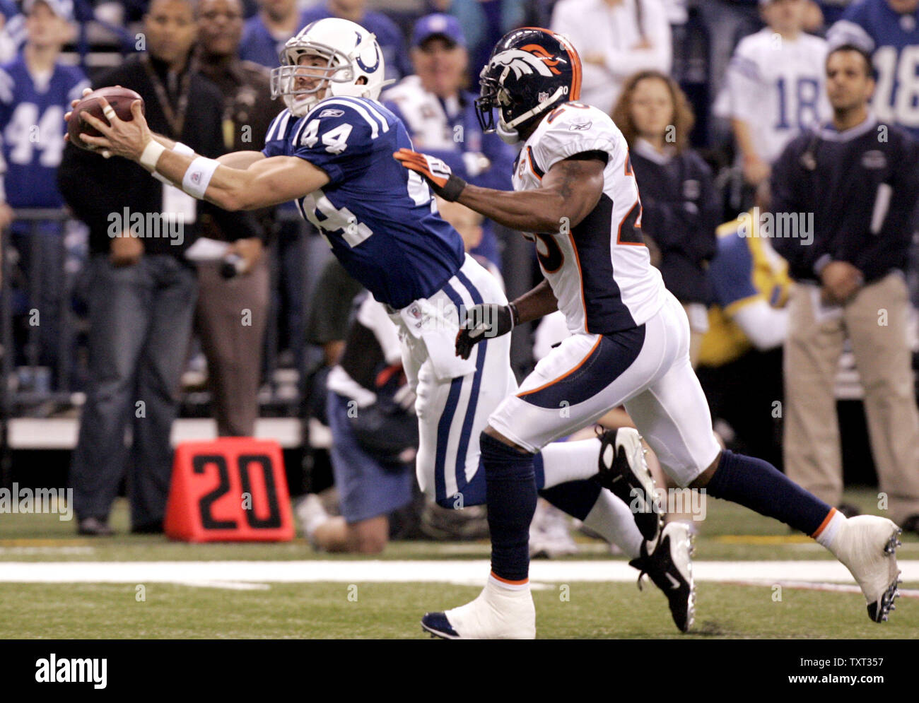 Indianapolis Colts tight end Dallas Clark (44) grabs a 22-yard catch in front of Denver Broncos safety Brian Dawkins (20) during the second quarter at Lucas Oil Field in Indianapolis on December 13, 2009. UPI /Mark Cowan Stock Photo