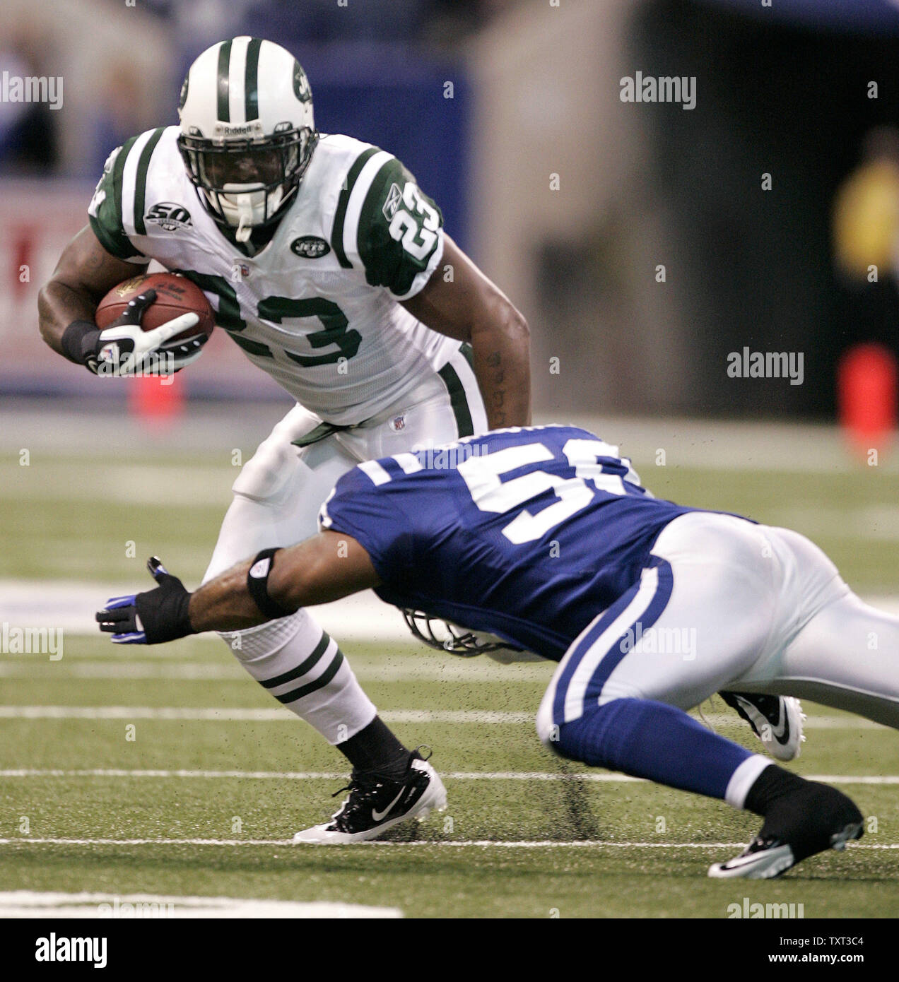 New York Jets kicker Jay Feely (3) misses a field goal as Kellen Clemens  (11) holds during the first quarter of their AFC Championship Playoff game  against the Indianapolis Colts at Lucas