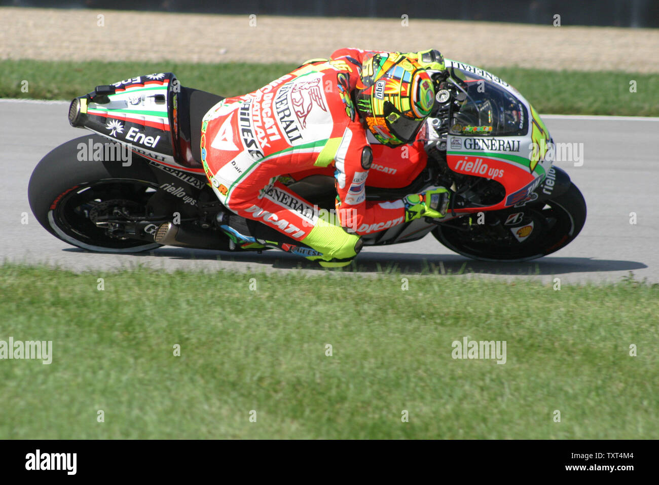 Valentino Rossi Speeds Through The Hair Pin Turn At The Indianapolis Motor Speedway During Practice For The Red Bull Moto Gp On August 17 12 In Indianapolis Indiana Upi Bill Coons Stock Photo