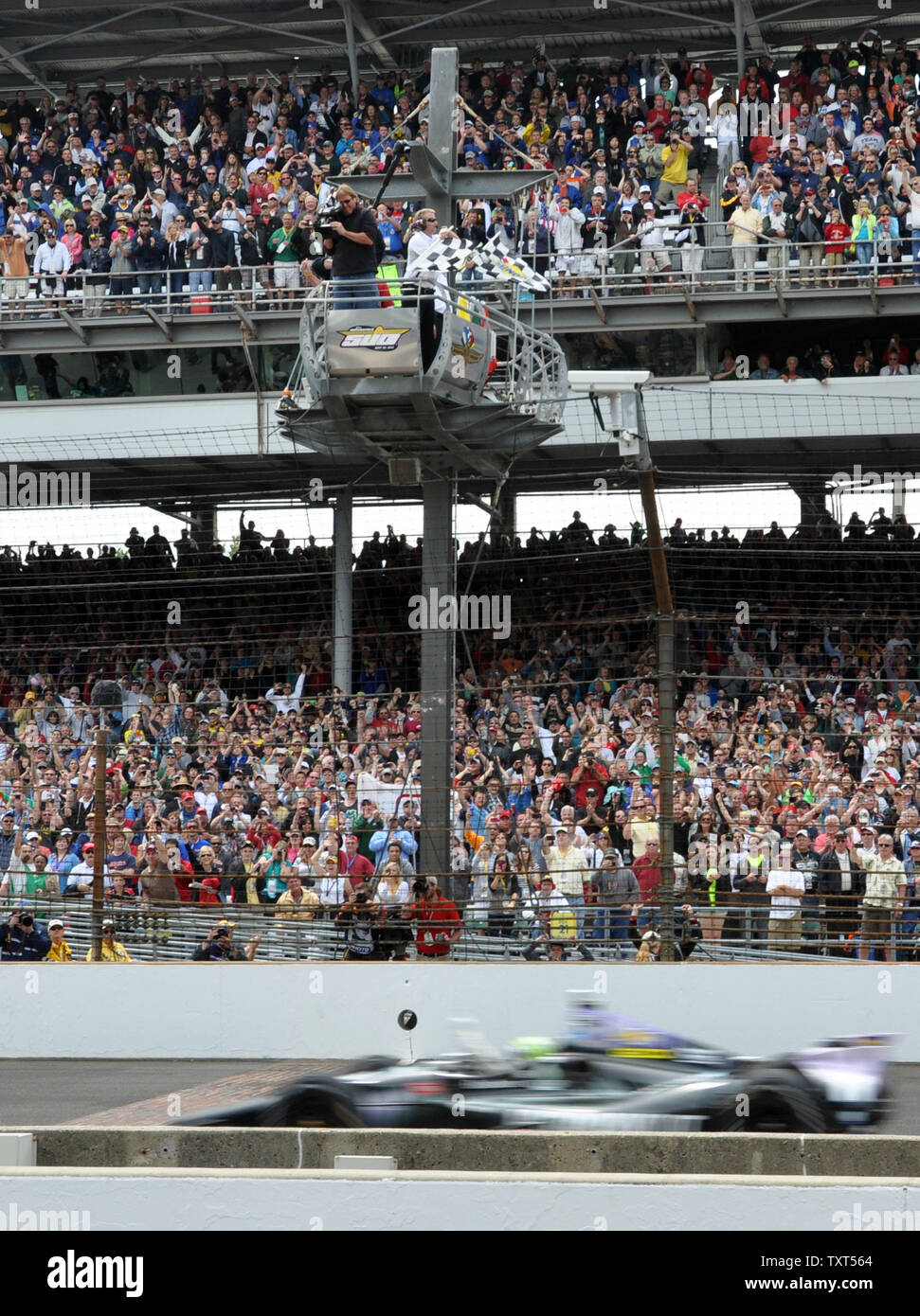 Tony Kanaan of Brazil crosses the finish line to win the 97th running of the Indianapolis 500 at Indianapolis Motor Speedway in Indianapolis, on May 26, 2013.  UPI /Mark Grosser Stock Photo