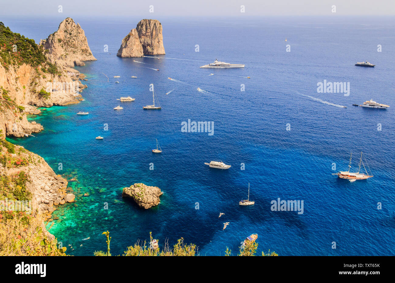 Panoramic view of famous Faraglioni Rocks, most visited travel ...
