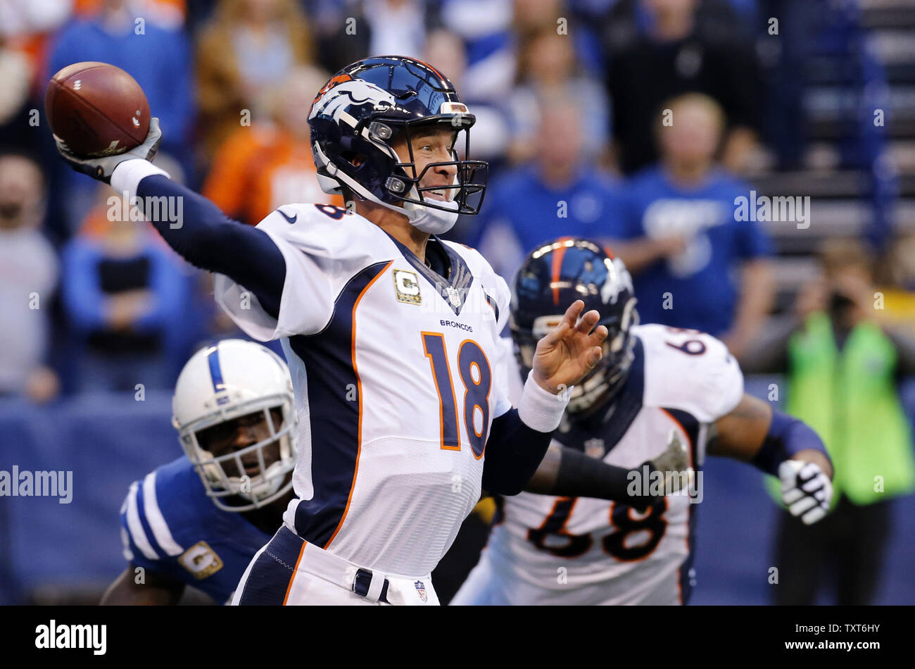 Denver Broncos quarterback Peyton Manning (18) throws under pressure ...
