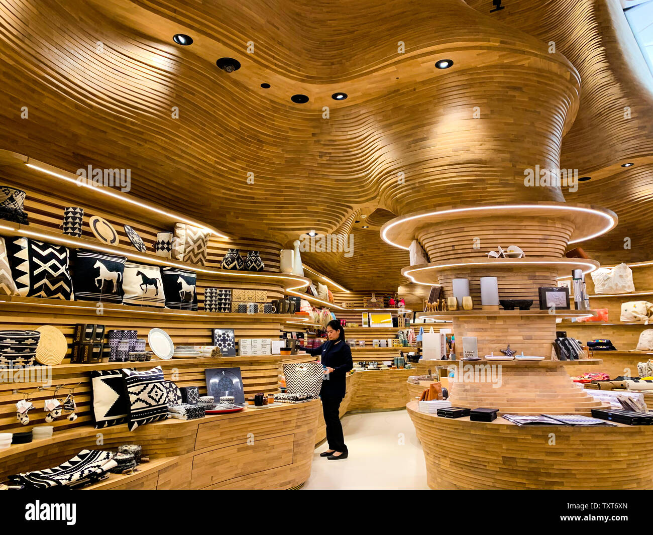 Wooden, dynamic and organic ceiling of the National Museum shop. April 2019, Doha. Stock Photo