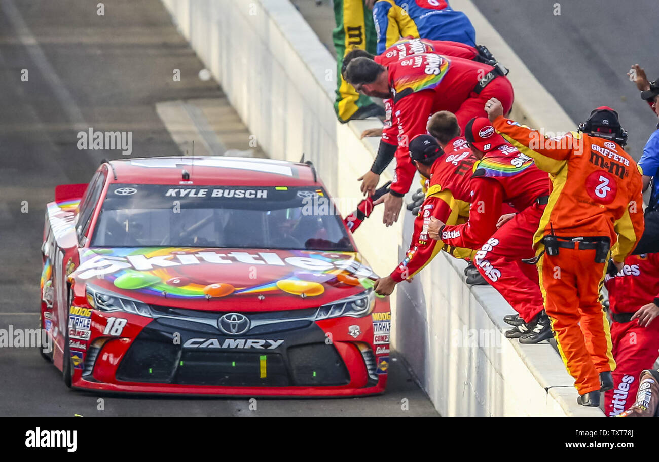 Kyle Busch celebrates with his crew after winning the 23rd Brickyard 400 at the Indianapolis Motor Speedway on July 24, 2016 in Indianapolis, Indiana.    Photo by Mike Gentry/UPI Stock Photo