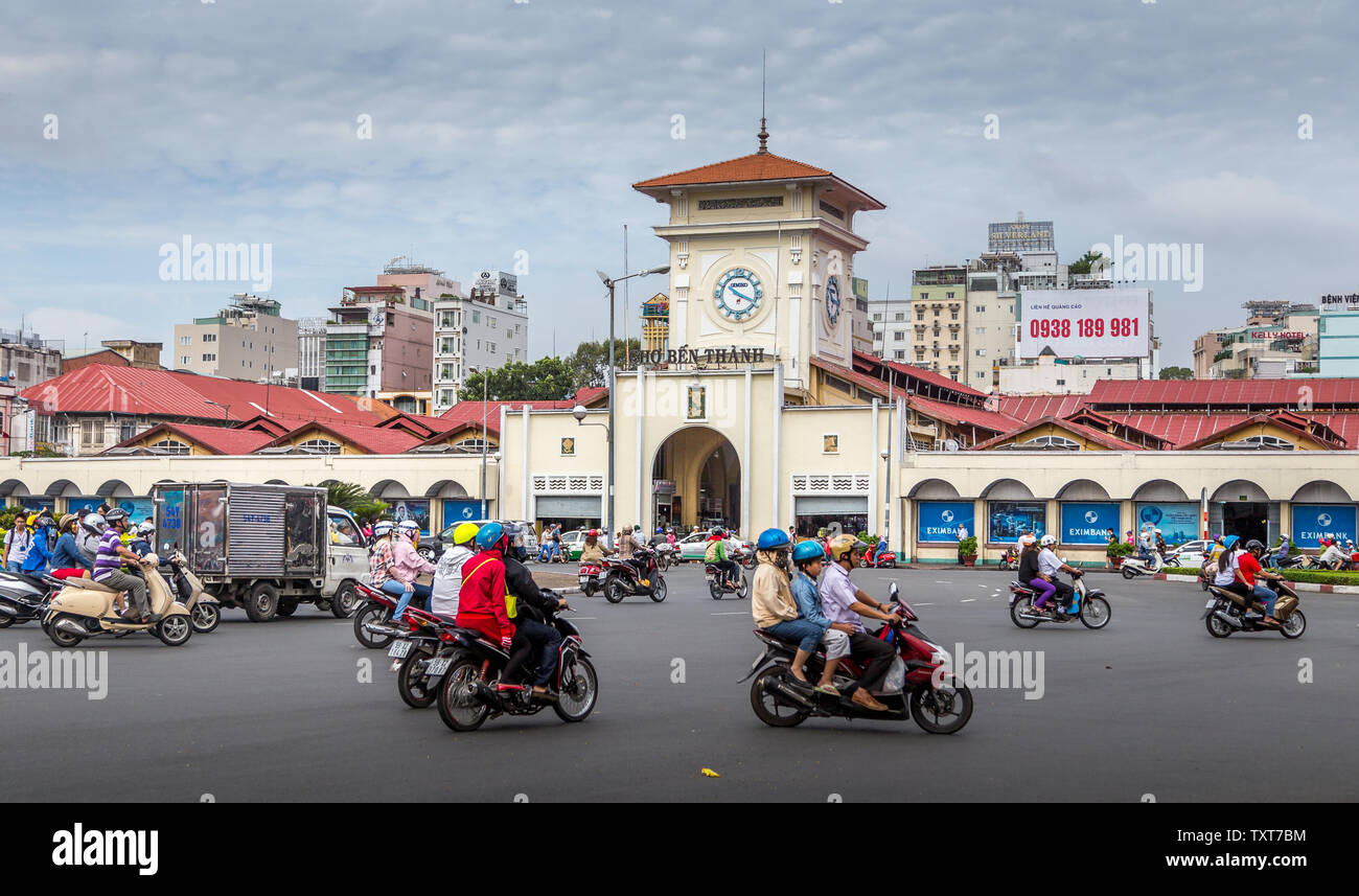 Ho Chi Minh City, Vietnam - December 14, 2013: street photo of the city with busy traffic of motorcycles Stock Photo