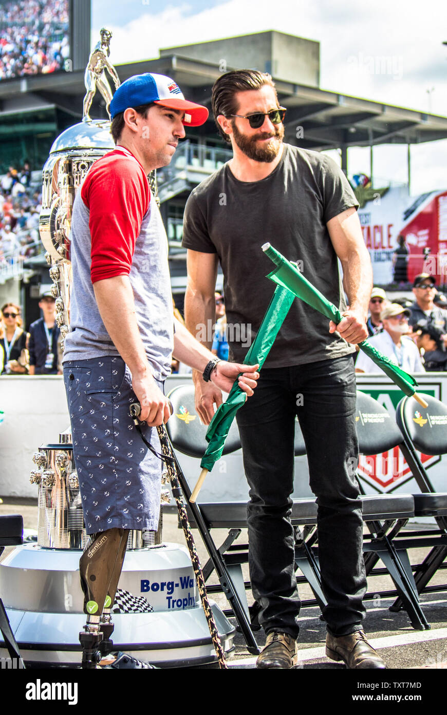 Jeff Bauman (left), who lost both his legs in the Boston Marathon bombing, waved the green flag with actor Jake Gyllenhaal to start the  2017 Indianapolis 500. Gyllenhaal portrays Bauman in the upcoming movie 'Stronger'. At the Indianapolis Motor Speedway on May 28, 2017 in Indianapolis, Indiana. Photo by Edwin Locke/UPI Stock Photo