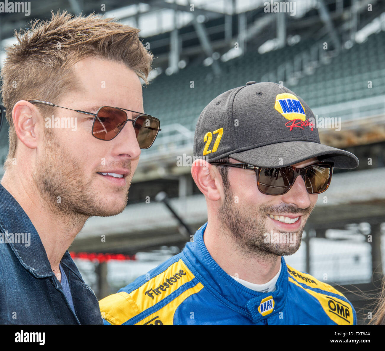 Actor Justin Hartley (left) and Alexander Rossi converse on pit row prior  to the 2019 Indycar Grand Prix, on May 11, 2019 in Indianapolis, Indiana.  Photo by Edwin Locke/UPI Stock Photo - Alamy