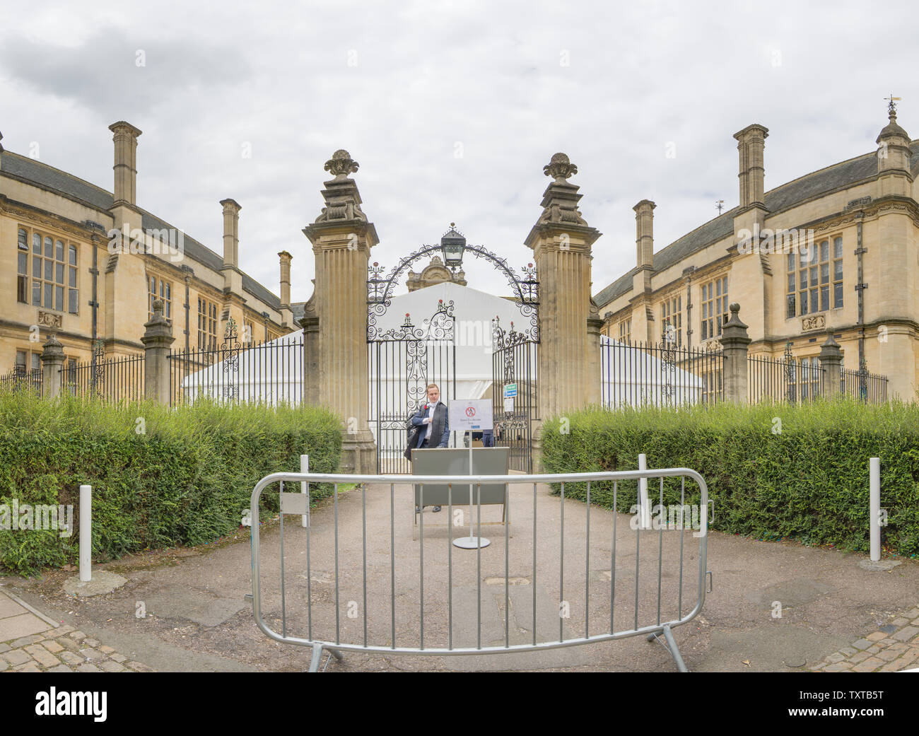After sitting an exam, a student leaves the Examinations Schools building, Oxford university, along Merton Street. Stock Photo