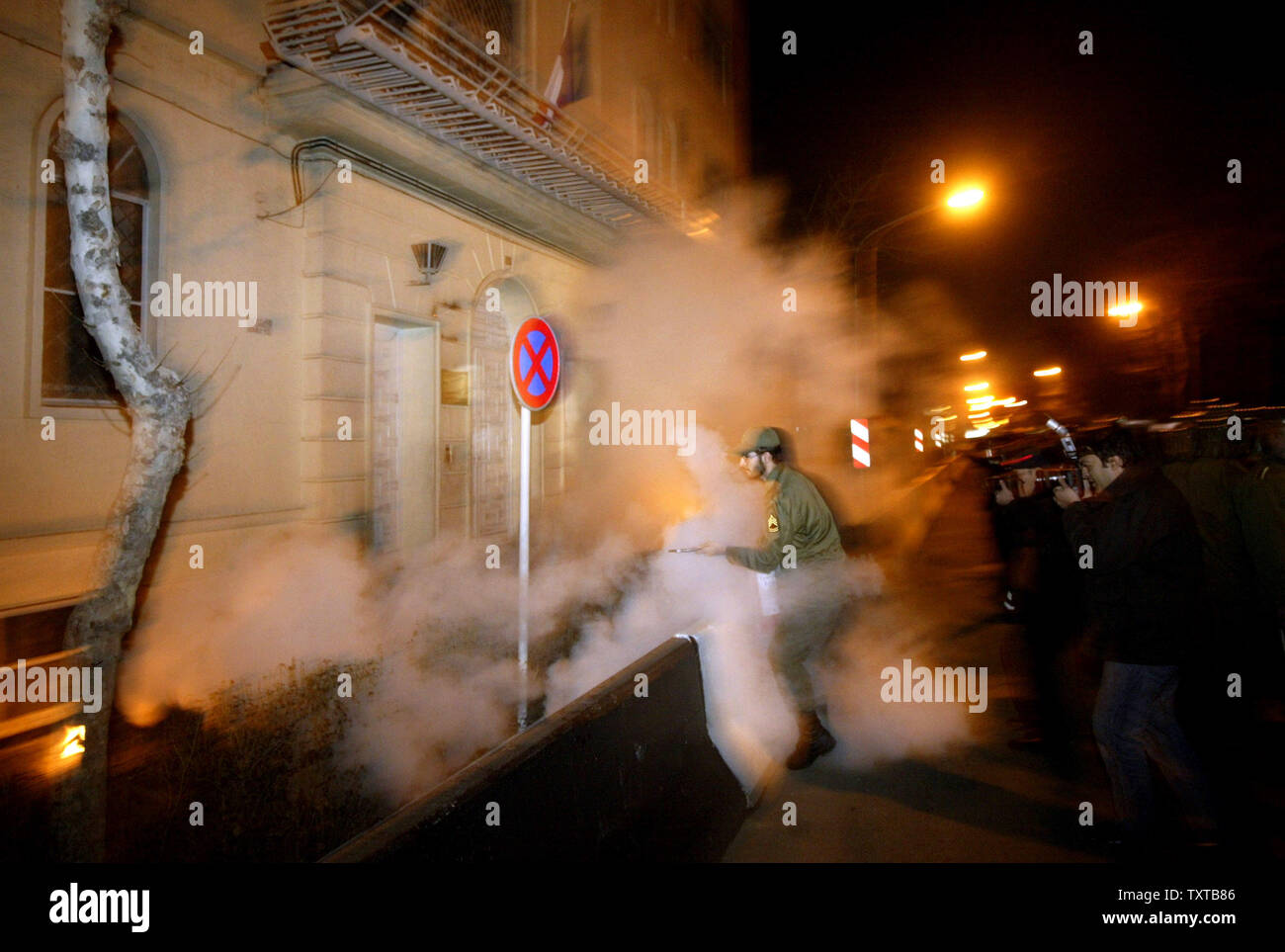 Iranian firemen put out a blaze during a demonstration in front of the French Embassy to support Iran's nuclear program and to protest a Danish newspaper cartoon perceived as an insult to the Prophet Mohammed in Tehran, Iran, February 10, 2006.  (UPI Photo/Mohammad Kheirkhah) Stock Photo