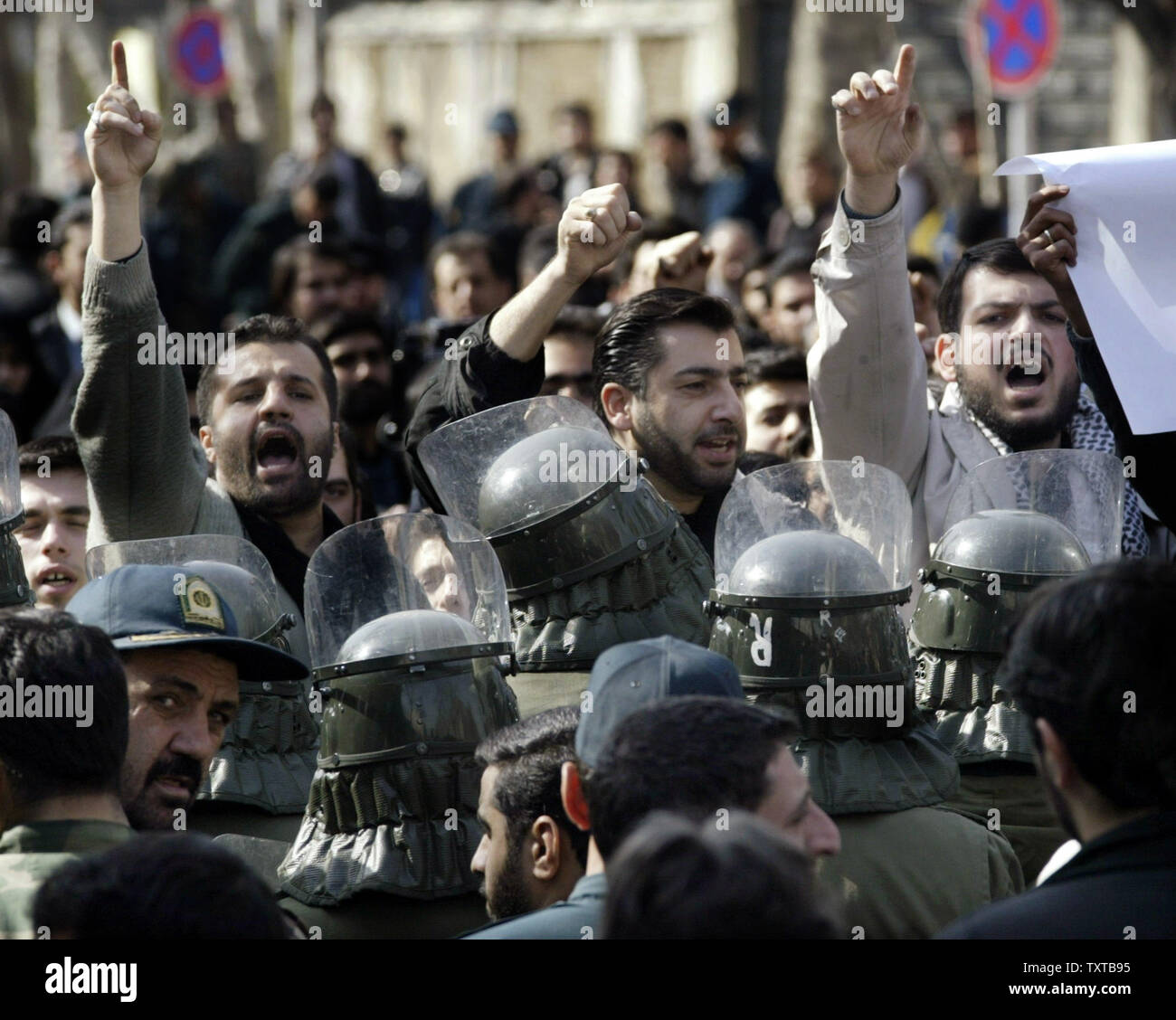Iranian students chant anti-French slogans during a demonstration in front of the French Embassy to support Iran's nuclear program and to protest a Danish newspaper cartoon that is perceived as an insult to the Prophet Mohammed in Tehran, Iran, February 12, 2006.  (UPI Photo/Mohammad Kheirkhah) Stock Photo