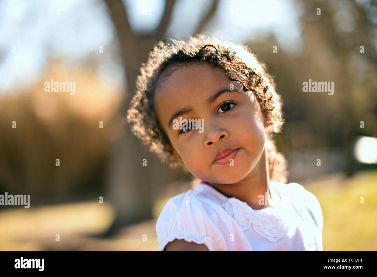 Portrait of young girl outside. Stock Photo
