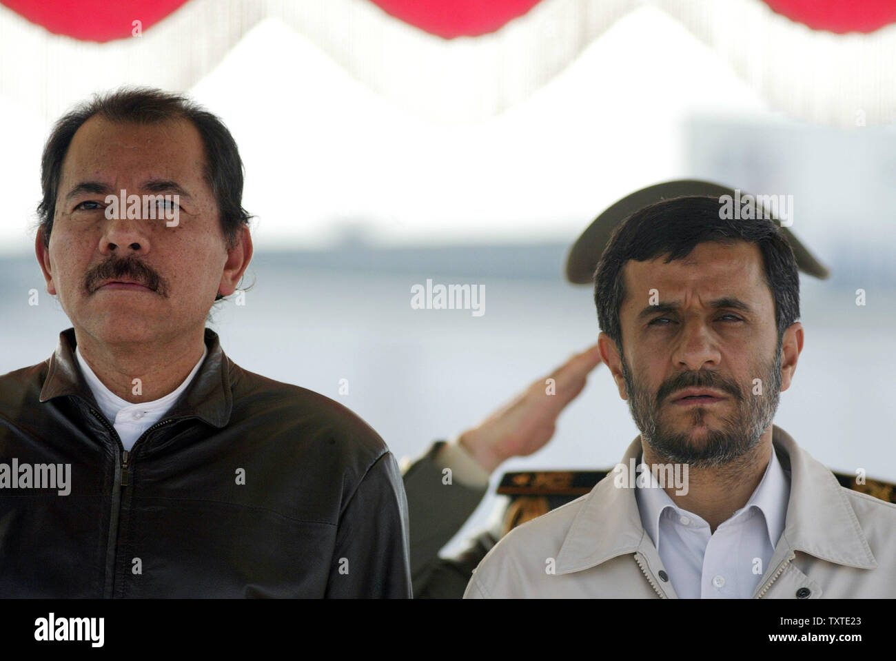 Nicaragua's President Daniel Ortega (L) and Iran's President Mahmoud Ahmadinejad listen to the national anthems of both countries after arriving at Mehrabad International Airport in Tehran, Iran on June 10, 2007. (UPI Photo/Mohammad Kheirkhah) Stock Photo