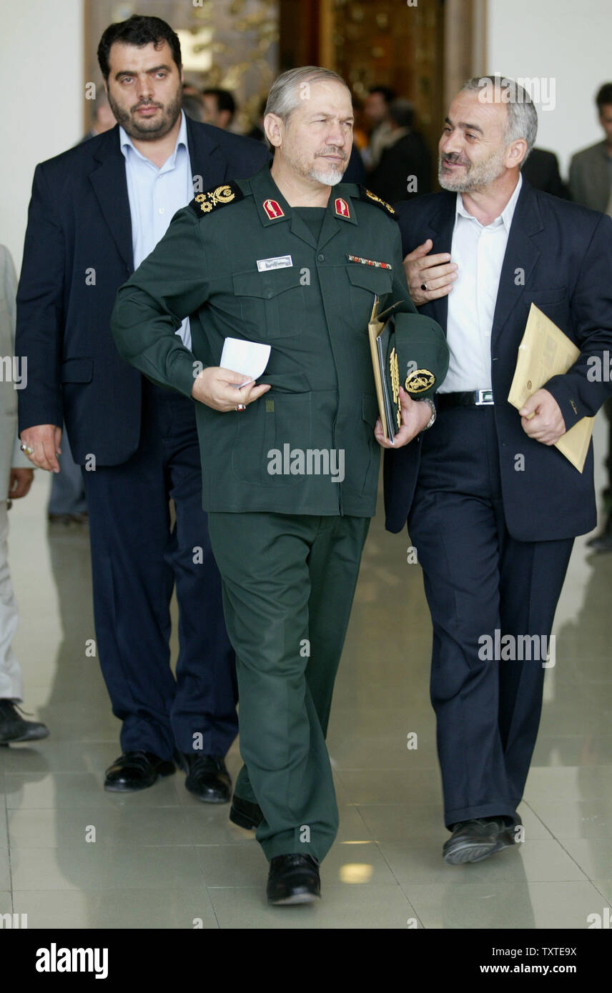 Commander of Iran's Islamic Revolutionary Guard Corps (IRGC) Yahya Rahim-Safavi (C) takes a letter from an unknow man while he escorts with one of his bodyguards during the inauguration ceremony of the 4th International General Assembly session of The Ahlul-Bayt World Assembly at Tehran Summit Hall in Tehran, Iran on August 18, 2007. Tehran has declared illegal the alleged intention by the US government to label the Iranian Revolutionary Guard as a foreign terrorist organization. (UPI Photo/Mohammad Kheirkhah) Stock Photo