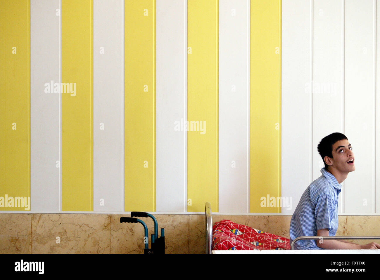 A patient rests as he looks on in a nursing home in Rasht city in Gilan
