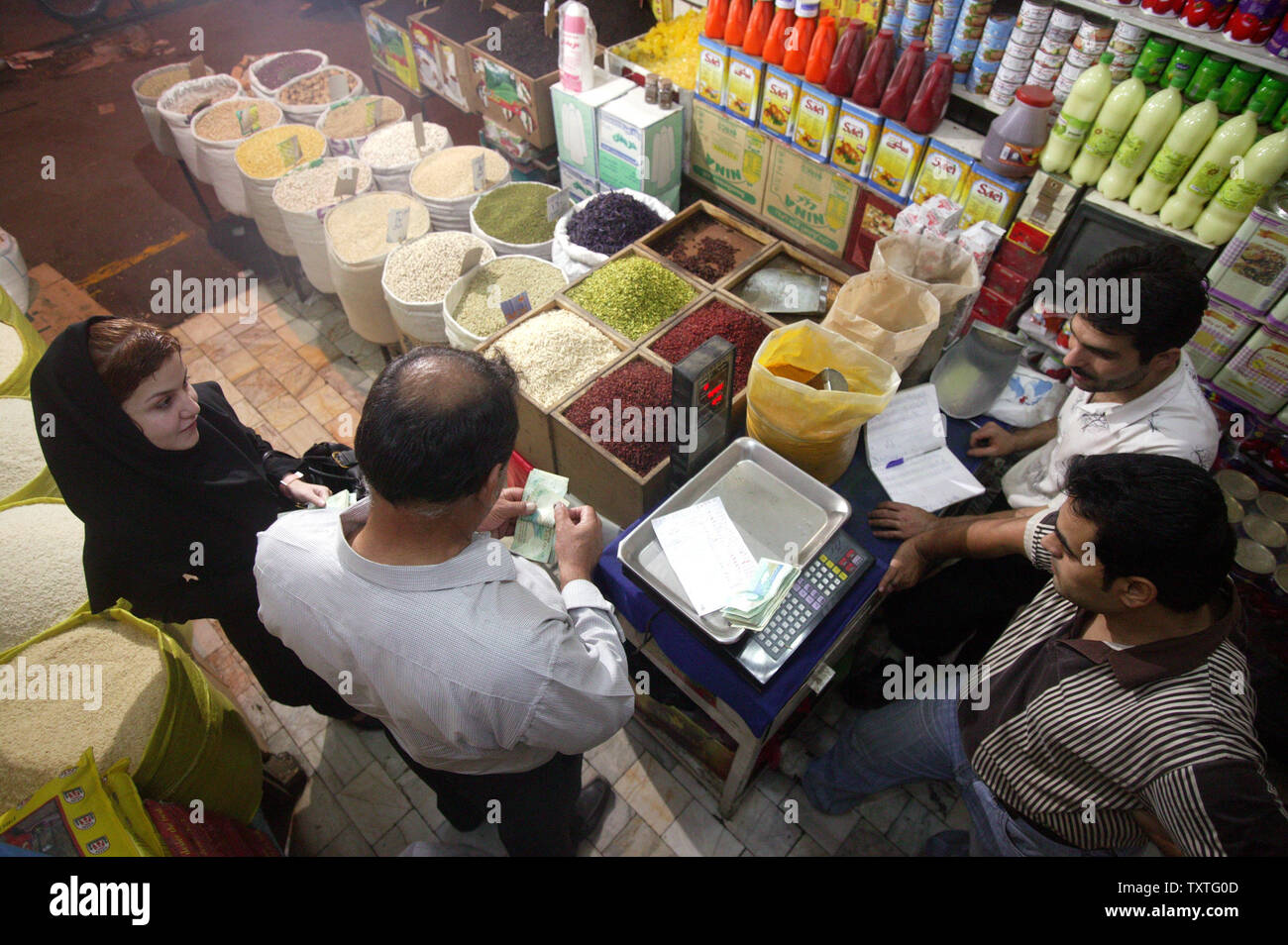 Iranians shop in the bazaar in Qazvin Province, 91 Miles (165 Km) west of Tehran, Iran on August 28, 2008. Iran's supreme leader called on the government of President Mahmoud Ahmadinejad to work on controlling rising prices, the main gripe among Iranians who fret about inflation now running at about 26 percent, state media reported. (UPI Photo/Mohammad Kheirkhah) Stock Photo