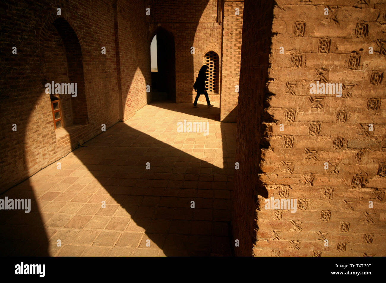 Parvaneh Mohasses, an Iranian woman, visits the dome of Soltanieh in Zanjan Province, 132 Miles (240 Km) northwest of Tehran, Iran on August 29, 2008. Soltanieh used to be the capital of Ilkhanid rulers of Persia in the 14th century as Its name translates as 'the Imperial'. In 2005, UNESCO listed Soltanieh as one of the World Heritage Sites. The estimated 200 ton dome stands 49 meters (161 ft) tall from its base, and is currently undergoing extensive renovation. (UPI Photo/Mohammad Kheirkhah) Stock Photo