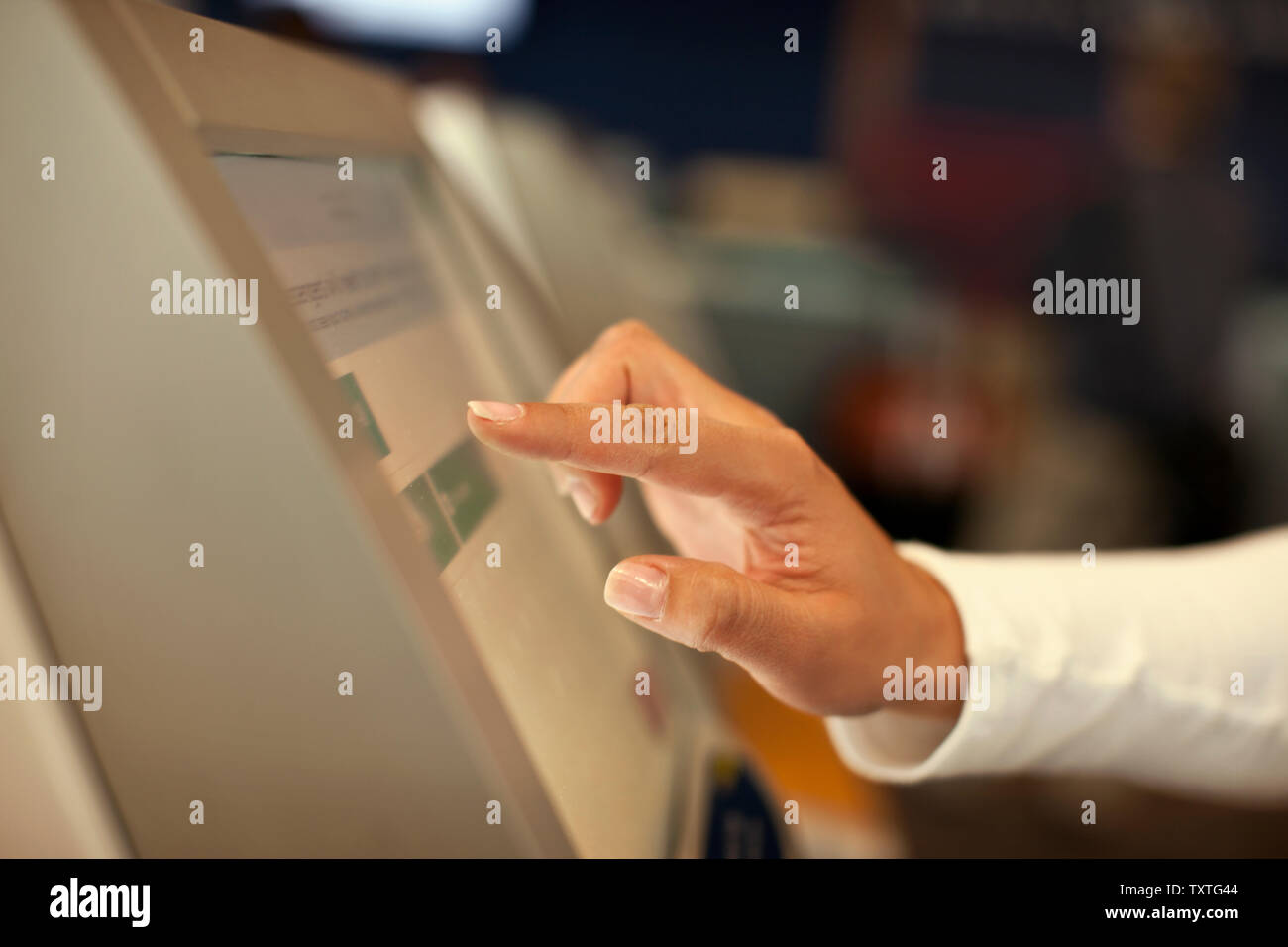 Hand of a mid adult man using a touch screen. Stock Photo