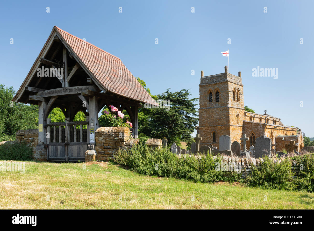 Harlestone, Northamptonshire, UK: Lych gate of St. Andrew's. The church's square tower dates from 12th century and is built of locally quarried stone. Stock Photo