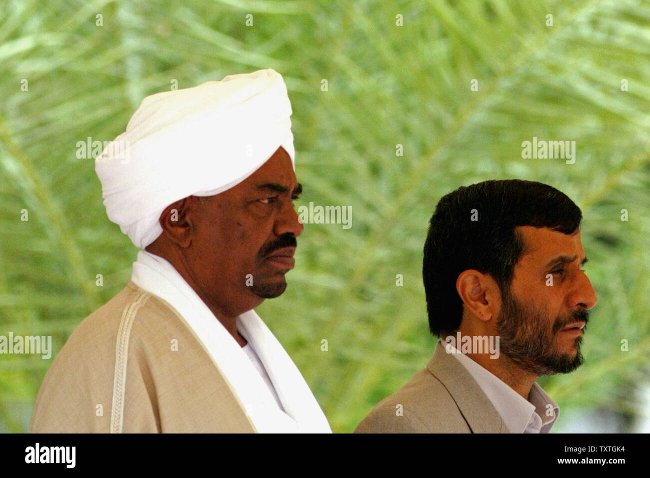 Iran's President Mahmoud Ahmadinejad (R) and Sudanese President Omar al-Bashir are seen in an April 26, 2006 file photo in Tehran, Iran. The International Criminal Court issued an arrest warrant March 4, 2009 for Sudanese President Omar al-Bashir on charges of war crimes and crimes against humanity in Darfur. (UPI Photo/Mohammad Kheirkhah) Stock Photo