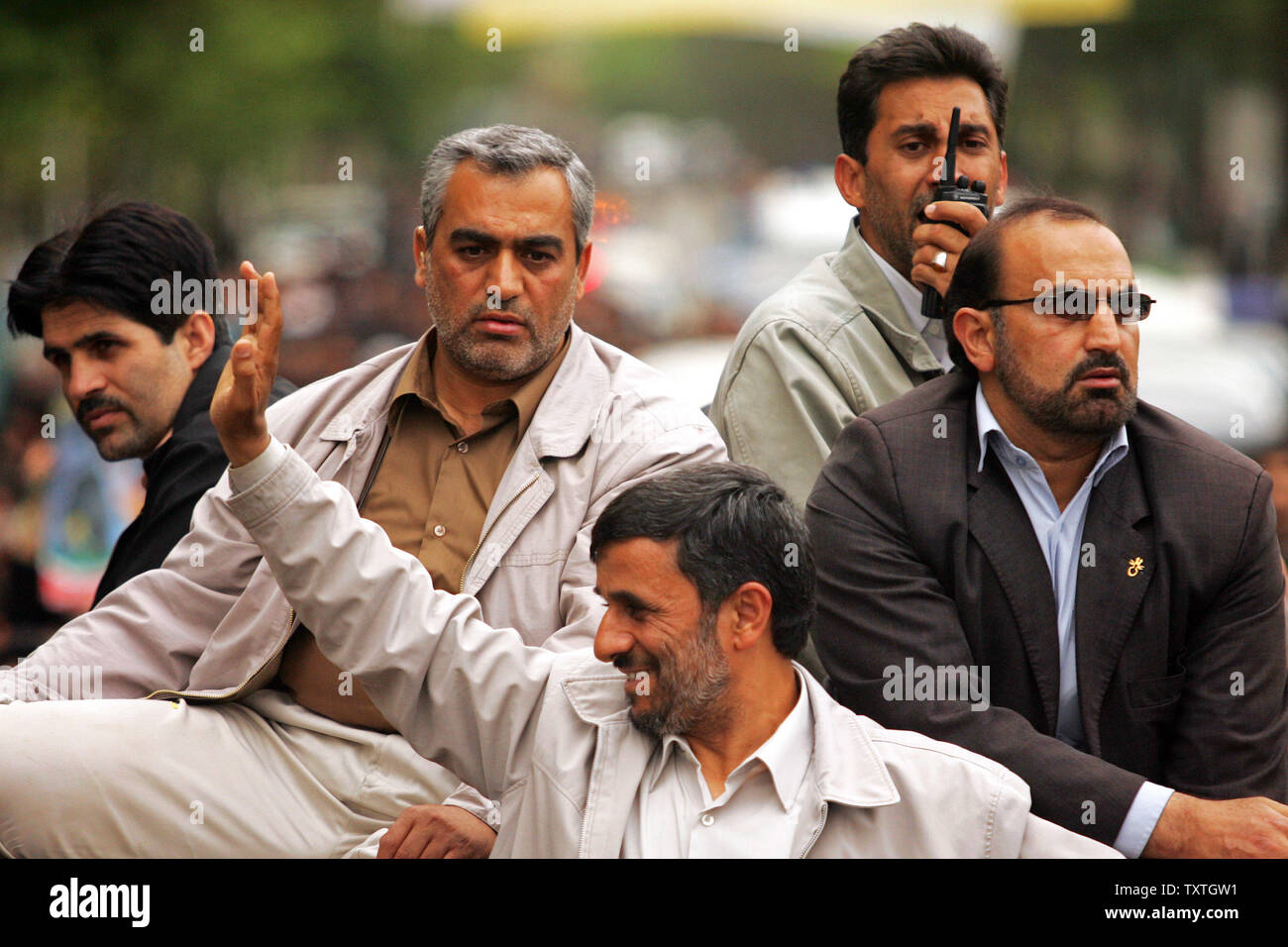 Iran s President Mahmoud Ahmadinejad C waves for his supporters
