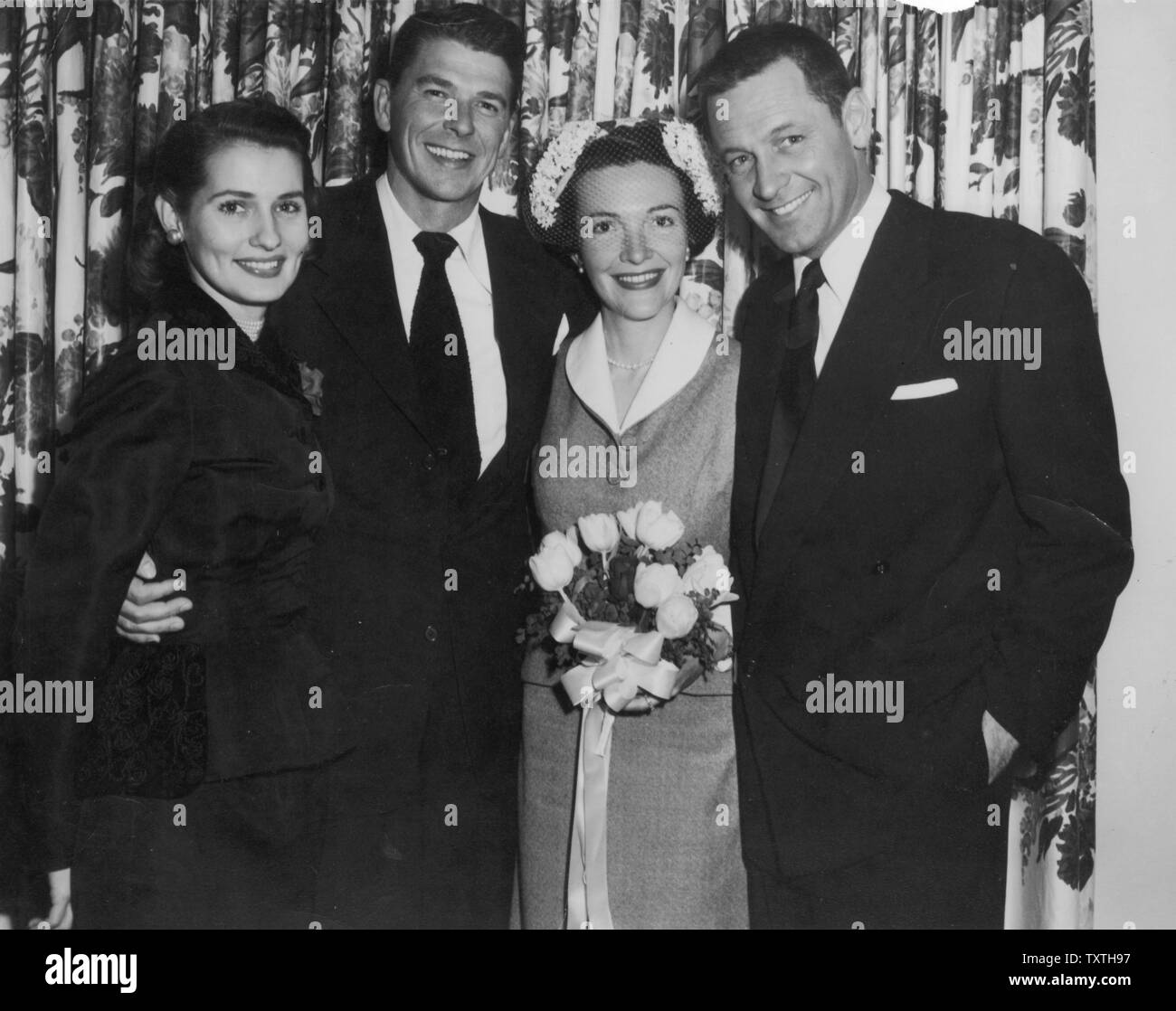 RONALD REGAN and wife Nancy on their wedding day 1 January 1952. William Holden at right was Best Man and  Maid of Honour was Phillipine-born actress Brenda Marshall.  Photo: White House Stock Photo