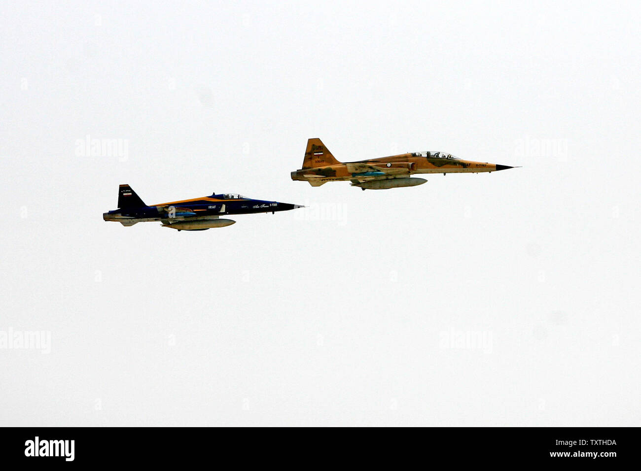 An Iranian Saegheh (Thunder), right, and F5 jet fighters fly during a large maneuver at Sea of Oman in Iran on June 23, 2009.  (UPI Photo/Ebrahim Norouzi/STR) Stock Photo