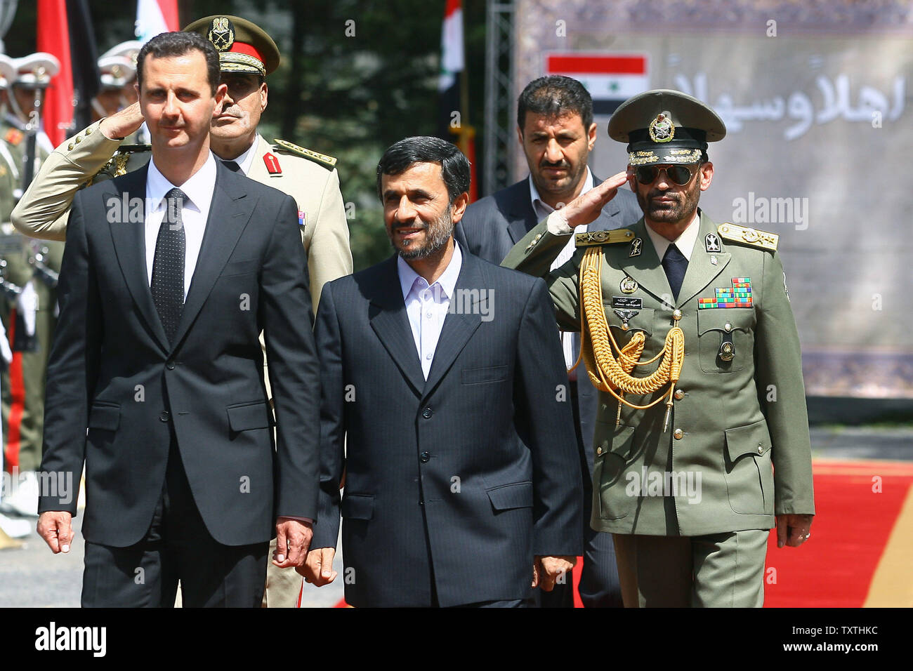Iranian President Mahmoud Ahmadinejad greets his Syrian counterpart Bashar al-Assad on August 19, 2009 at the presidential palace in Tehran , Iran .      UPI/Maryam Rahmaniani... Stock Photo