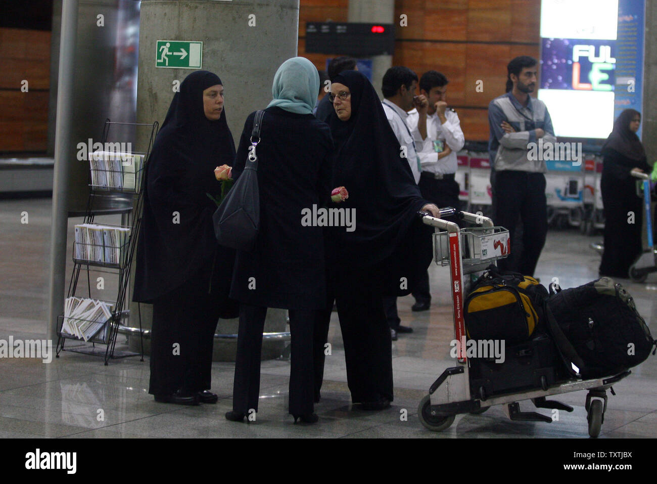 Cindy Hickey (L) and Nora Shroud (R) speak with Swiss Ambassador Livia Leu Agosti in Imam Khomeini Airport on May 19, 2010 after arriving to visit their imprisoned children. Shane Bauer, 27, Sarah Shourd, 31, and Josh Fattal, 27, were detained on July 31,2009 after straying across Iran's border while on a hiking trip in northern Iraq's Kurdistan region.       UPI/Maryam Rahmanian Stock Photo